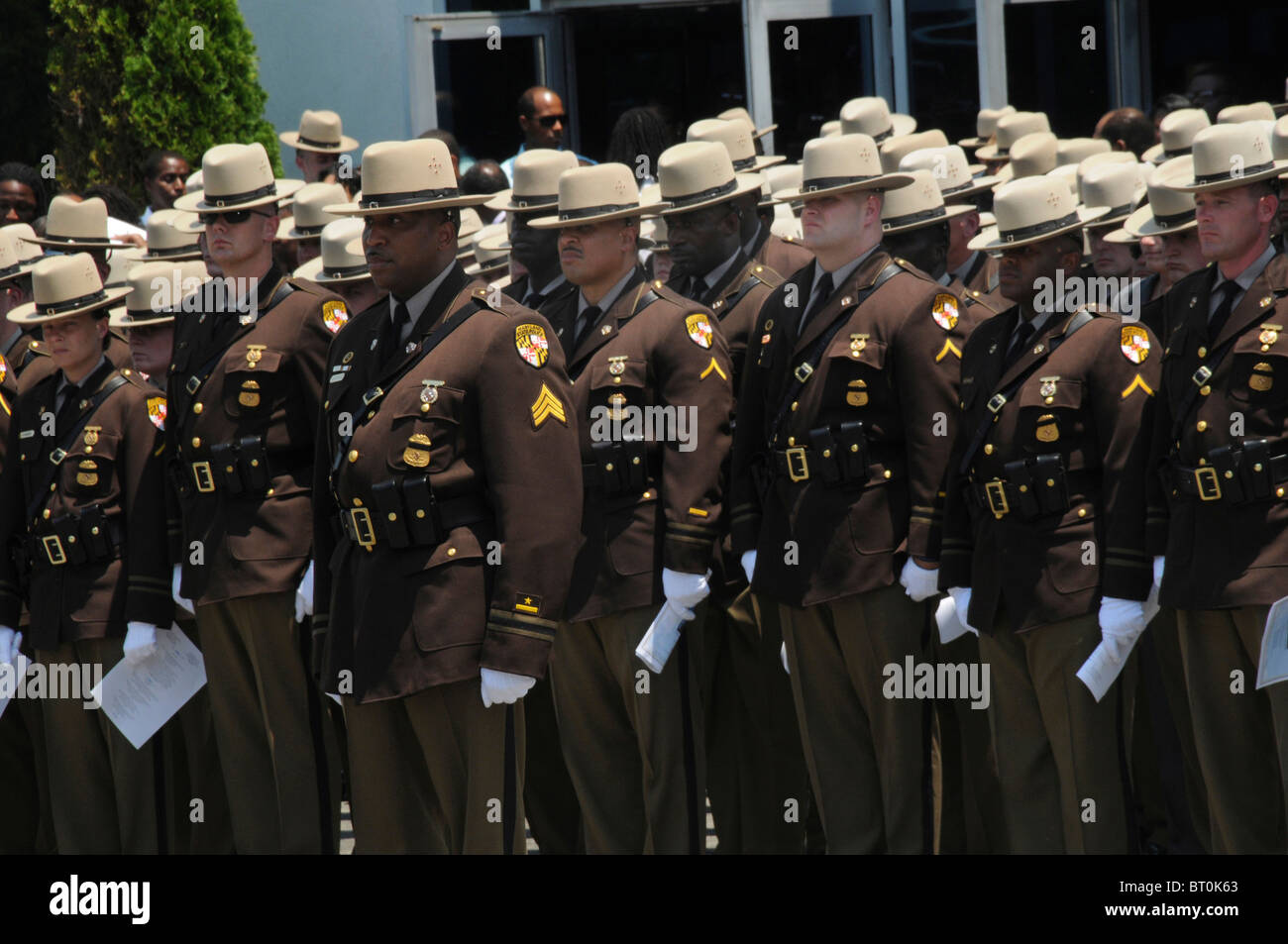 Maryland State Troopers  stand at attention at a funeral for a Maryland State trooper who was killed  in the line of duty Stock Photo