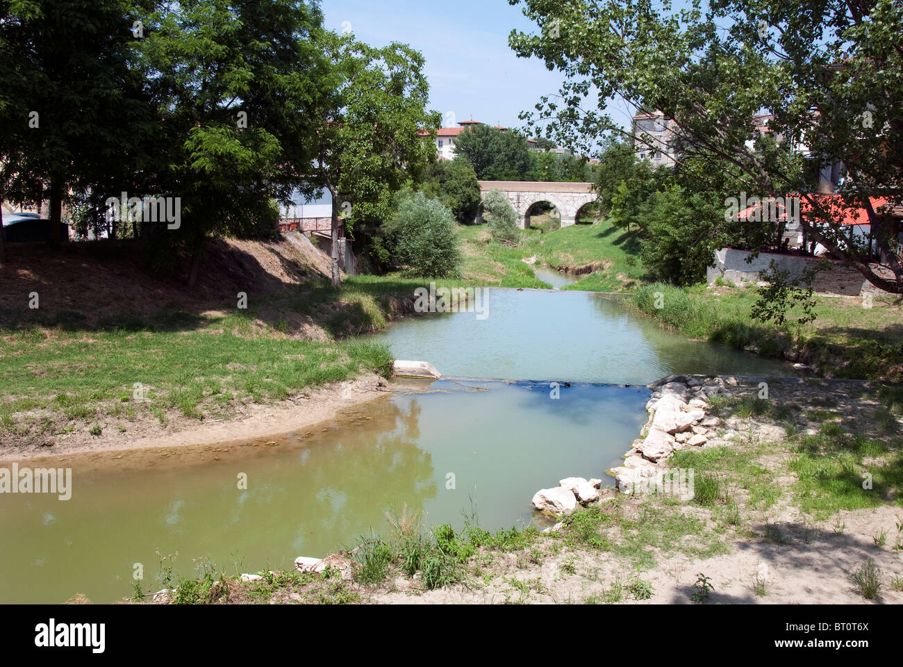 The bridge over the Rubicon River where Julius Caesar crossed the boundry of the Roman Republic in 49BC Stock Photo