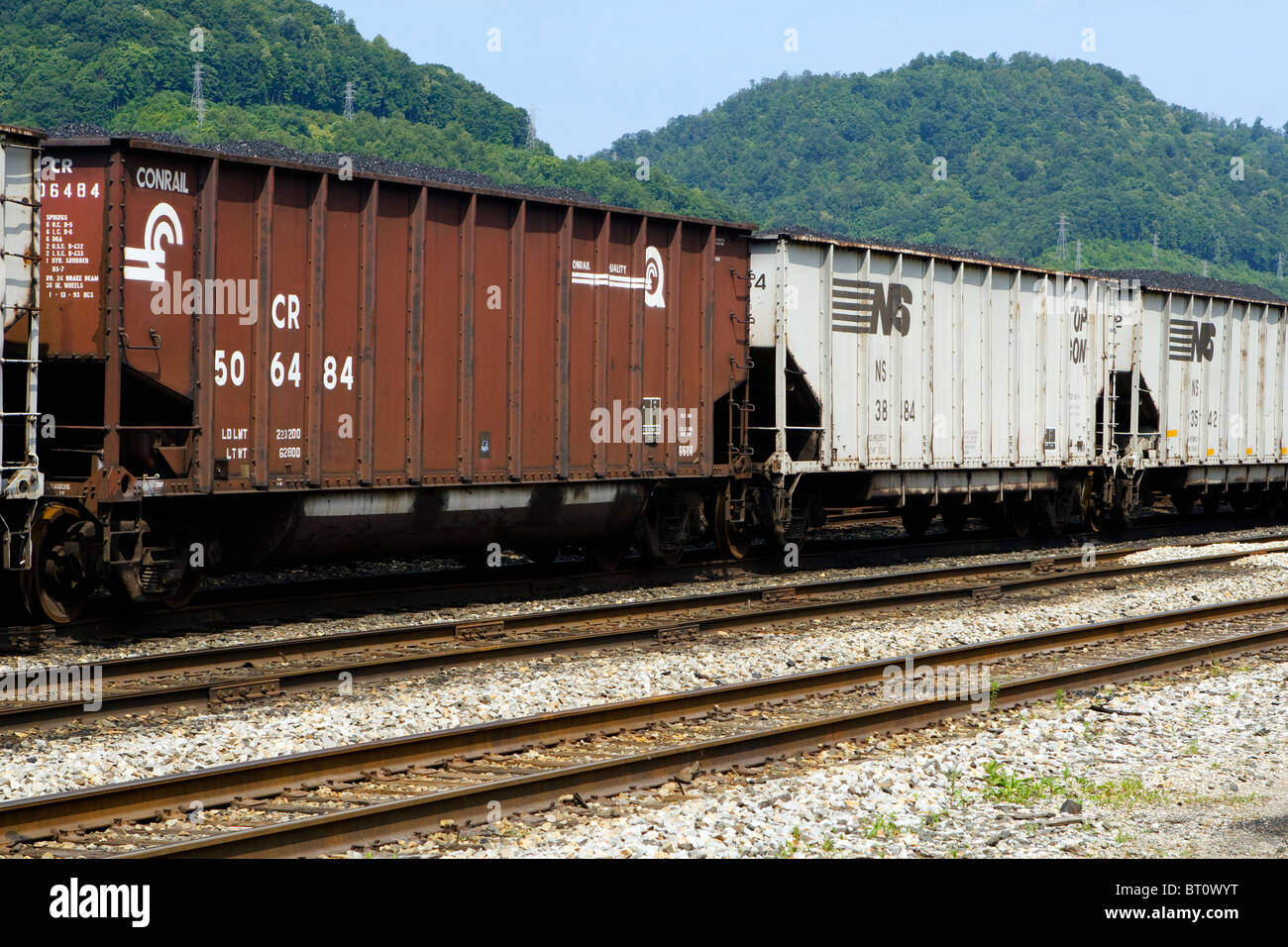 A row of railroad coal cars in a rail yard in West Virgina, USA. Stock Photo