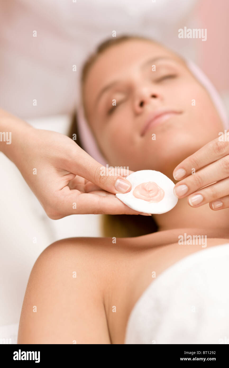 Facial care - woman cosmetics treatment in salon Stock Photo