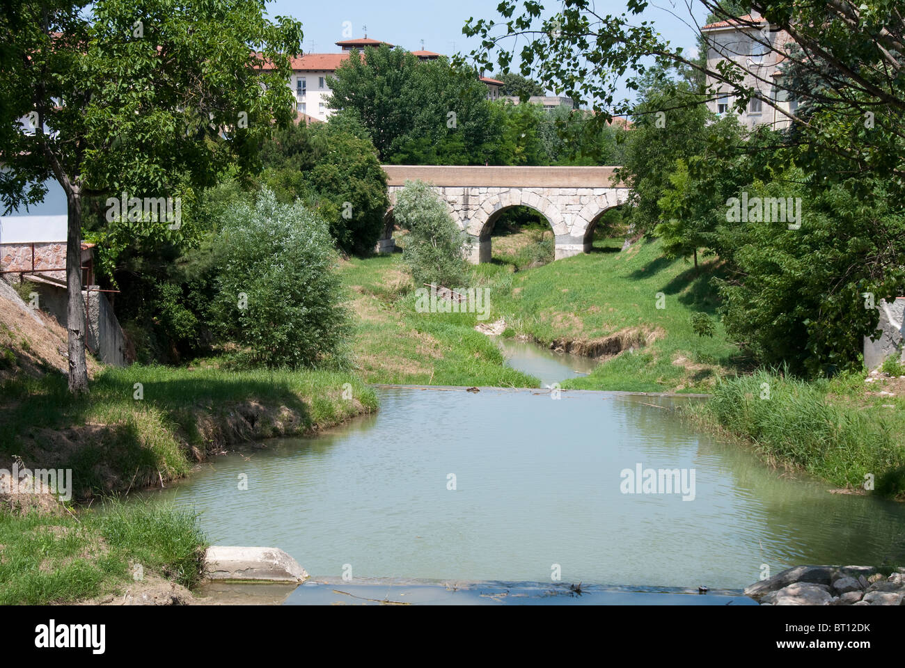 The bridge over the Rubicon River where Julius Caesar crossed the boundry of the Roman Republic in 49BC Stock Photo