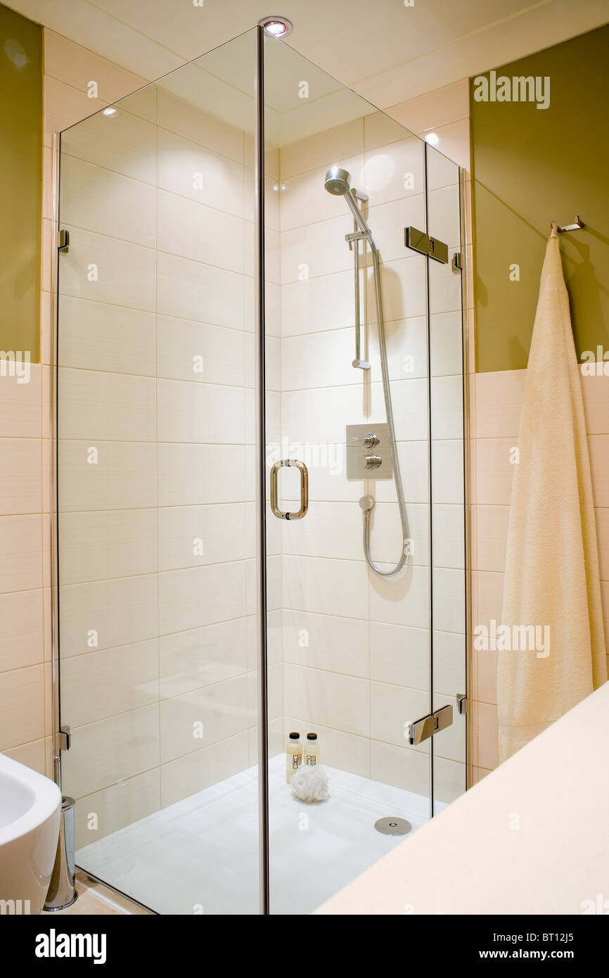 Glass shower cabinet in modern tiled bathroom Stock Photo - Alamy
