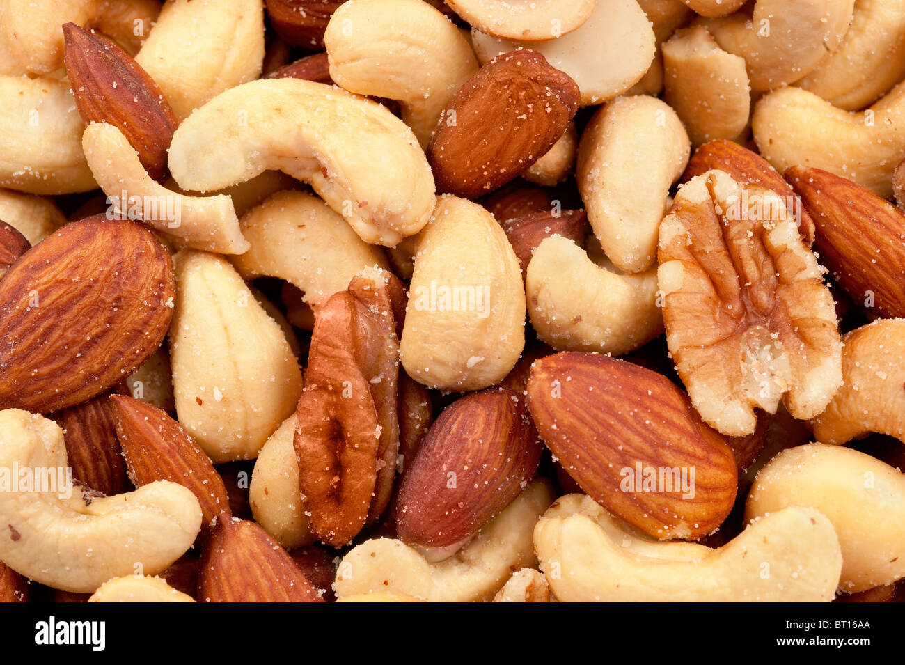 Mixed nuts including almonds, cashews, hazelnuts and walnuts sprinkled