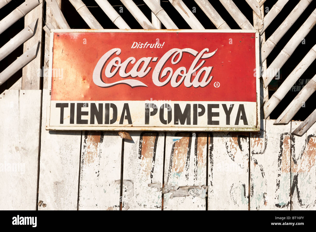 Advertising sign on old wooden shop building, Napo, Ecuador Stock Photo