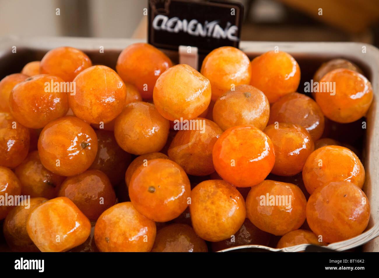 Bowl of Clementines for sale in street market stall, during the Tall