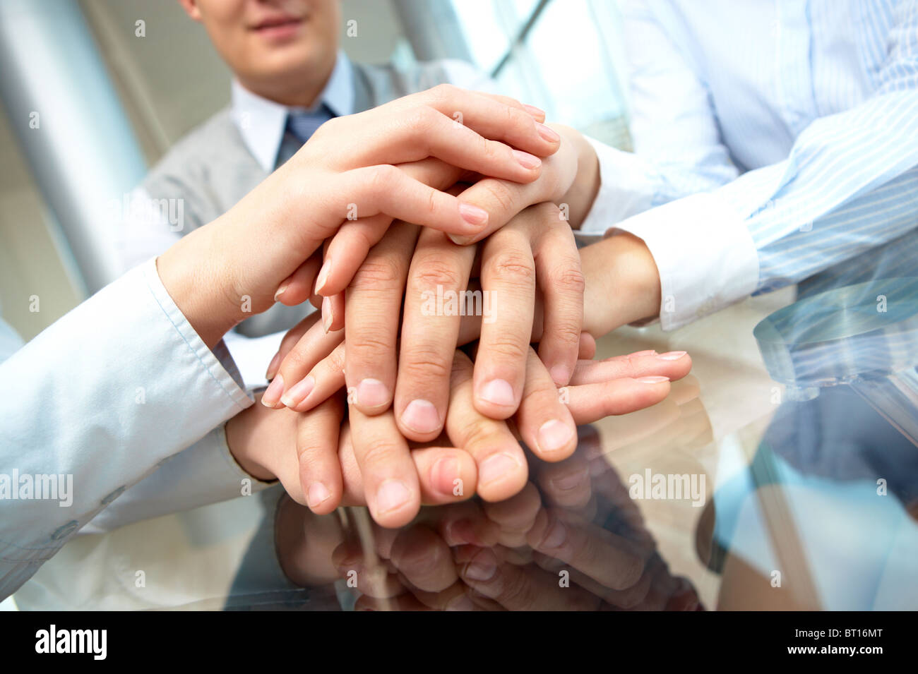 Image of business people hands on top of each other Stock Photo - Alamy