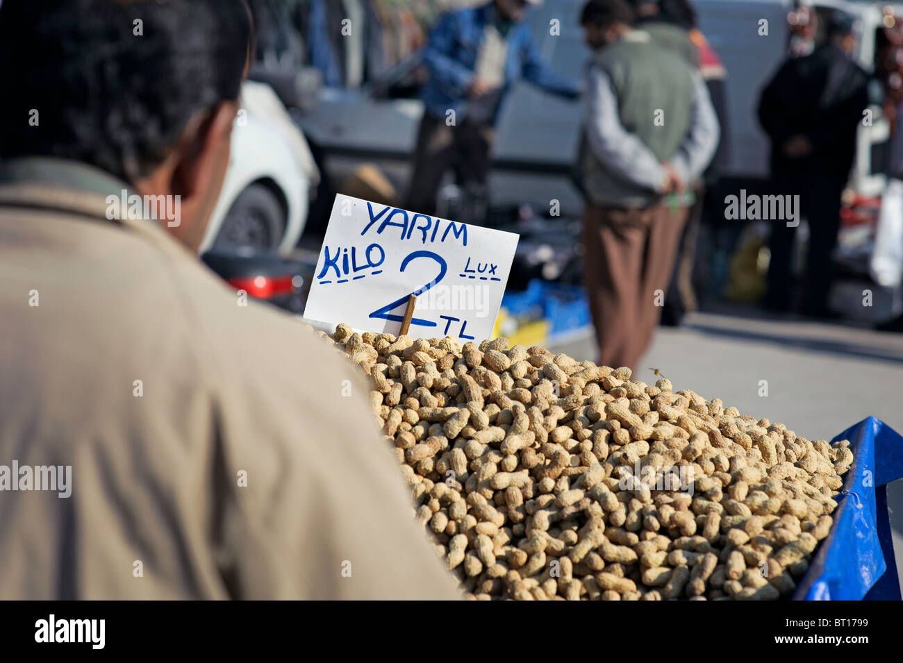 A man selling peanuts within the Izmir flea market. Stock Photo