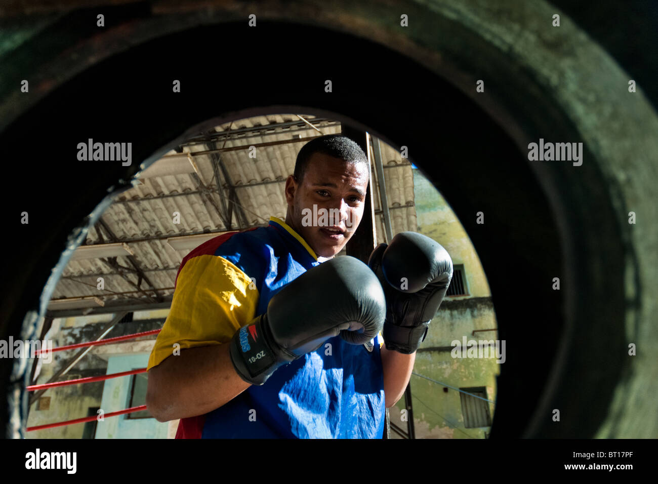 A Cuban boxer trains punches at Rafael Trejo boxing gym, an outdoor sport facility in the Old Havana, Cuba. Stock Photo
