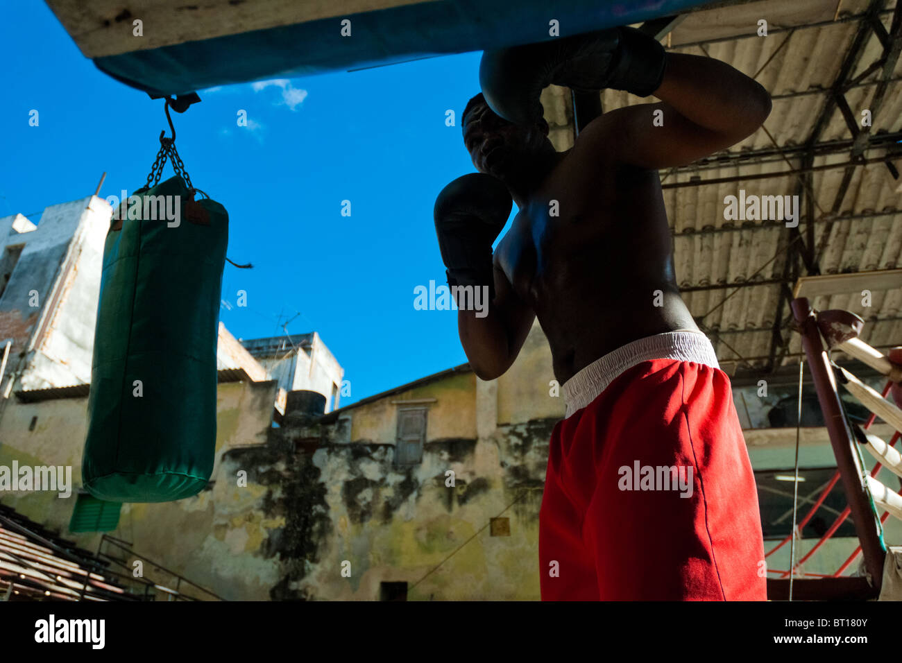 A Cuban boxer trains punching at Rafael Trejo boxing gym, an outdoor