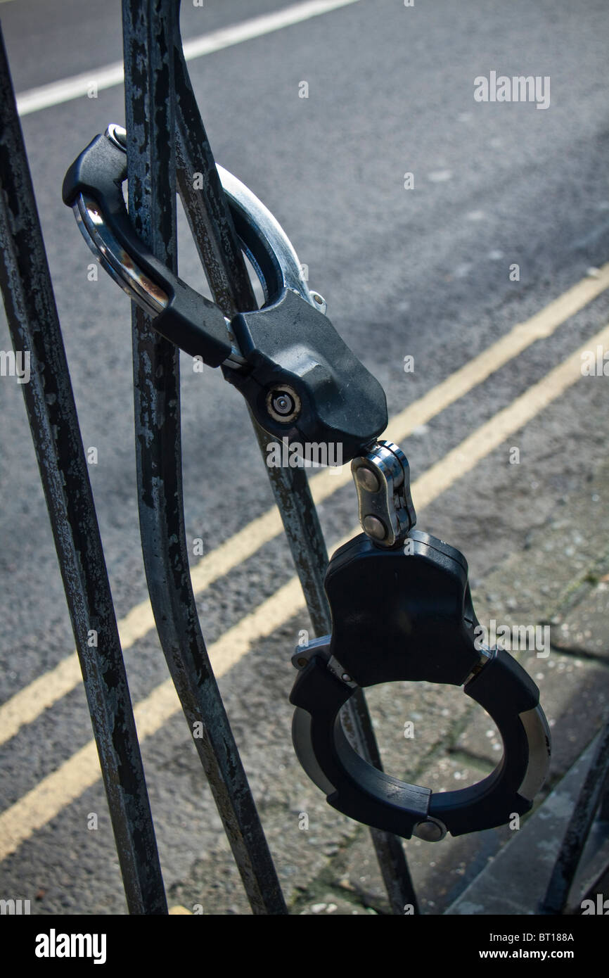 Police handcuffs attached to railings in Norwich, Norfolk Stock Photo