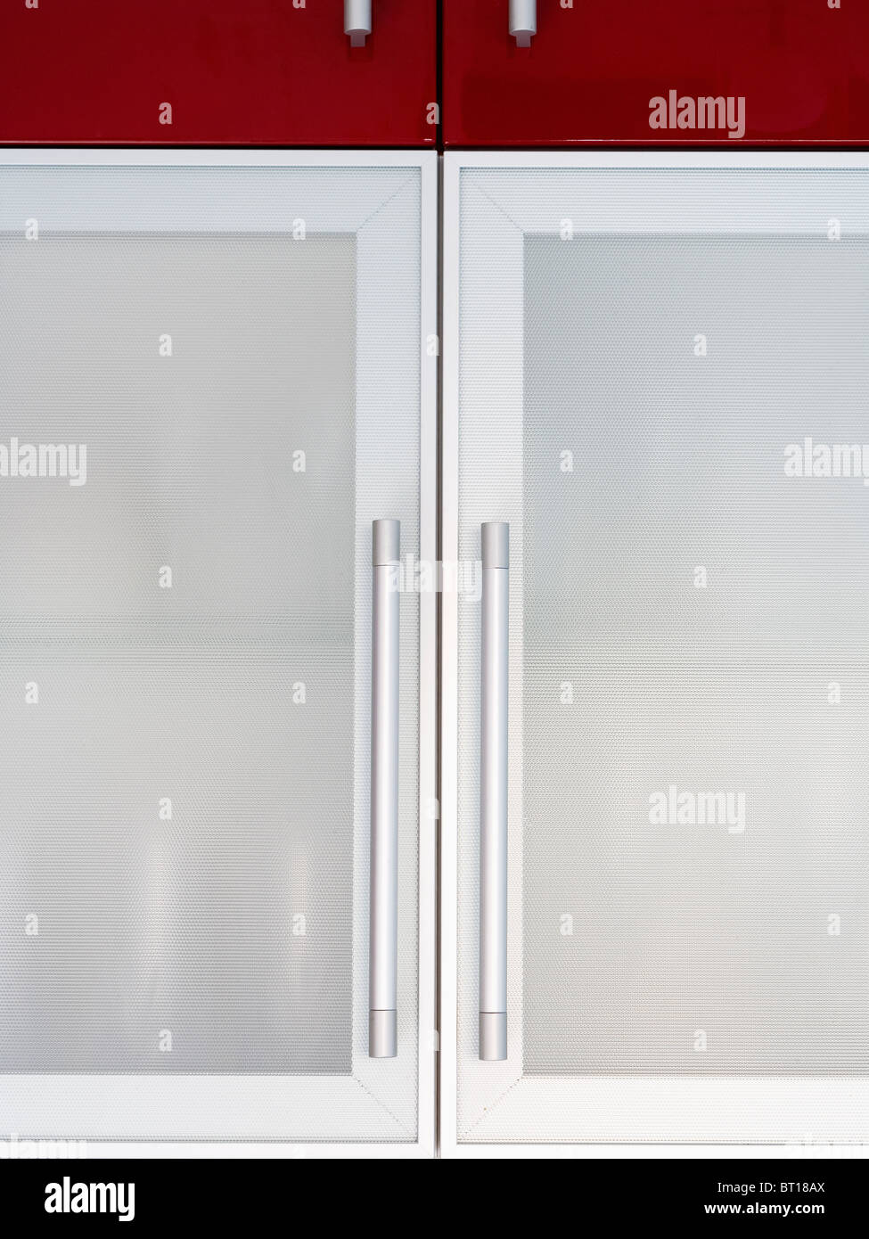 Close Up Of Kitchen Cupboard With Opaque Glass Doors With Steel Stock Photo Alamy