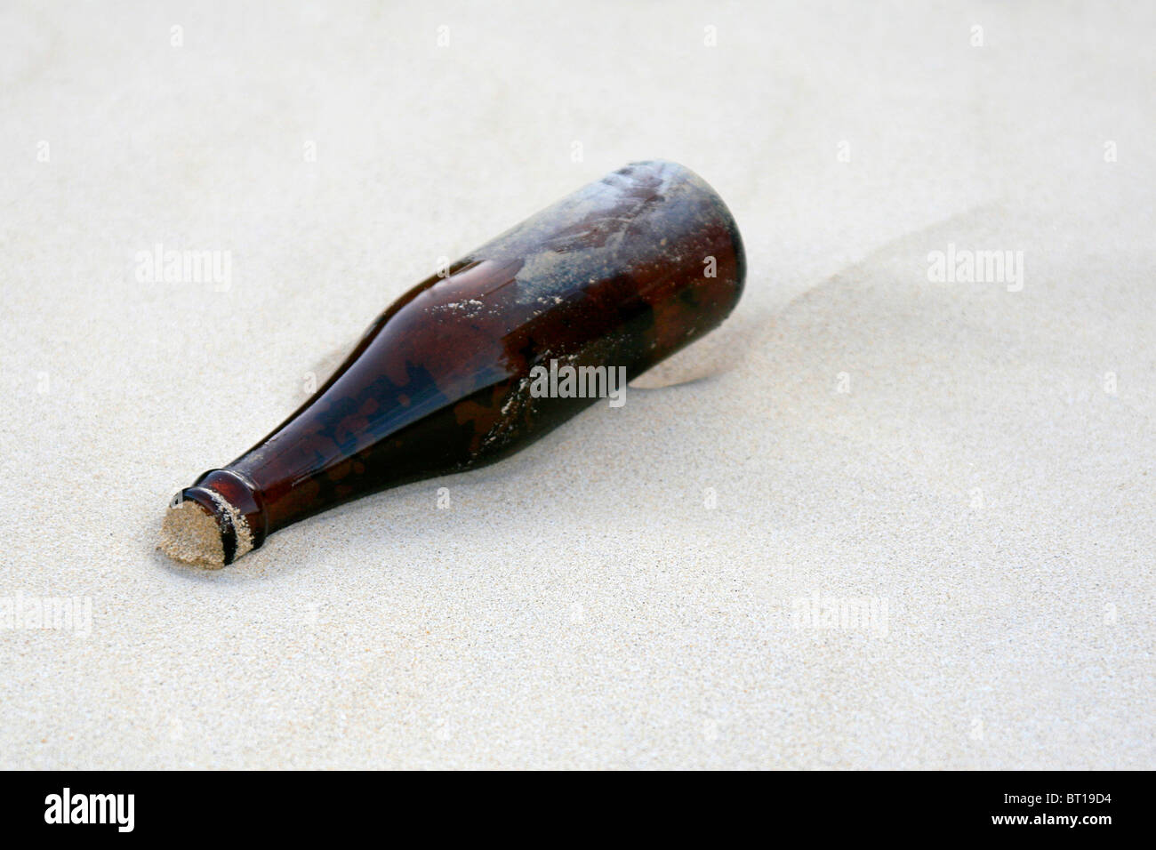 message in a bottle on a beach Stock Photo