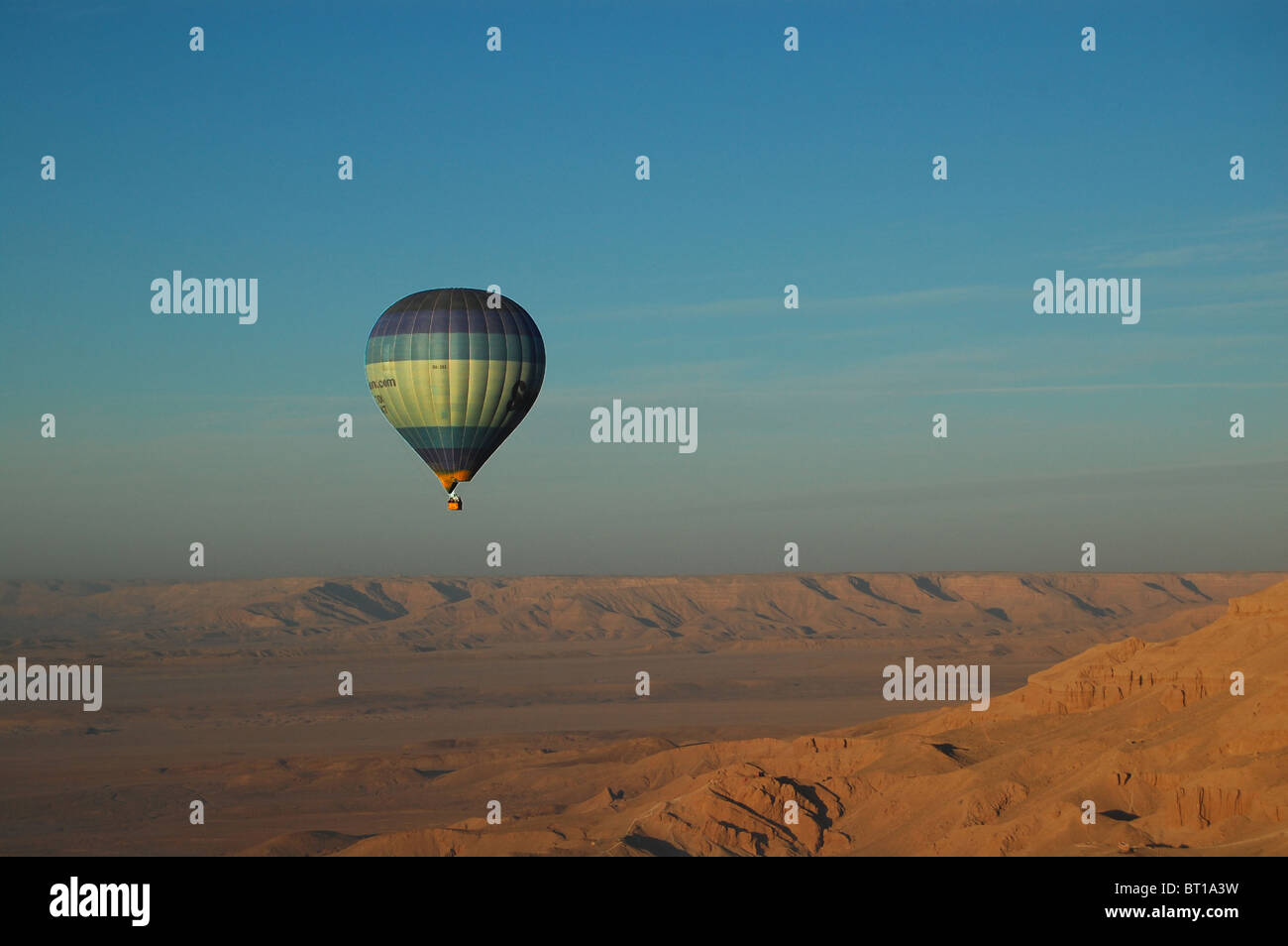 Hot air balloon ride above the Valley of the Kings, Luxor, Egypt at dawn Stock Photo