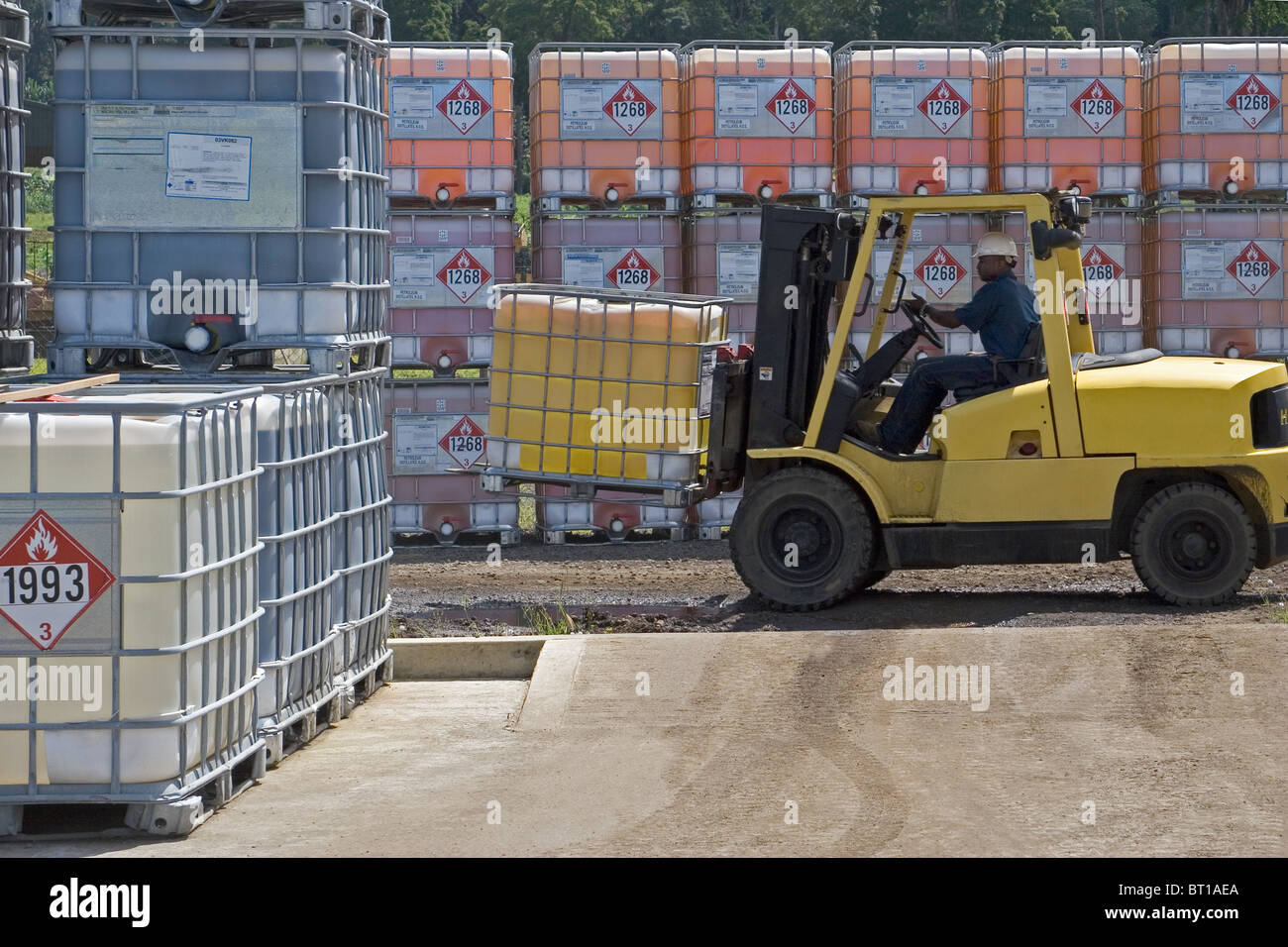 Luba Oil Freeport. Moving and loading chemical supplies in bunded area for use in offshore oil production industry Stock Photo