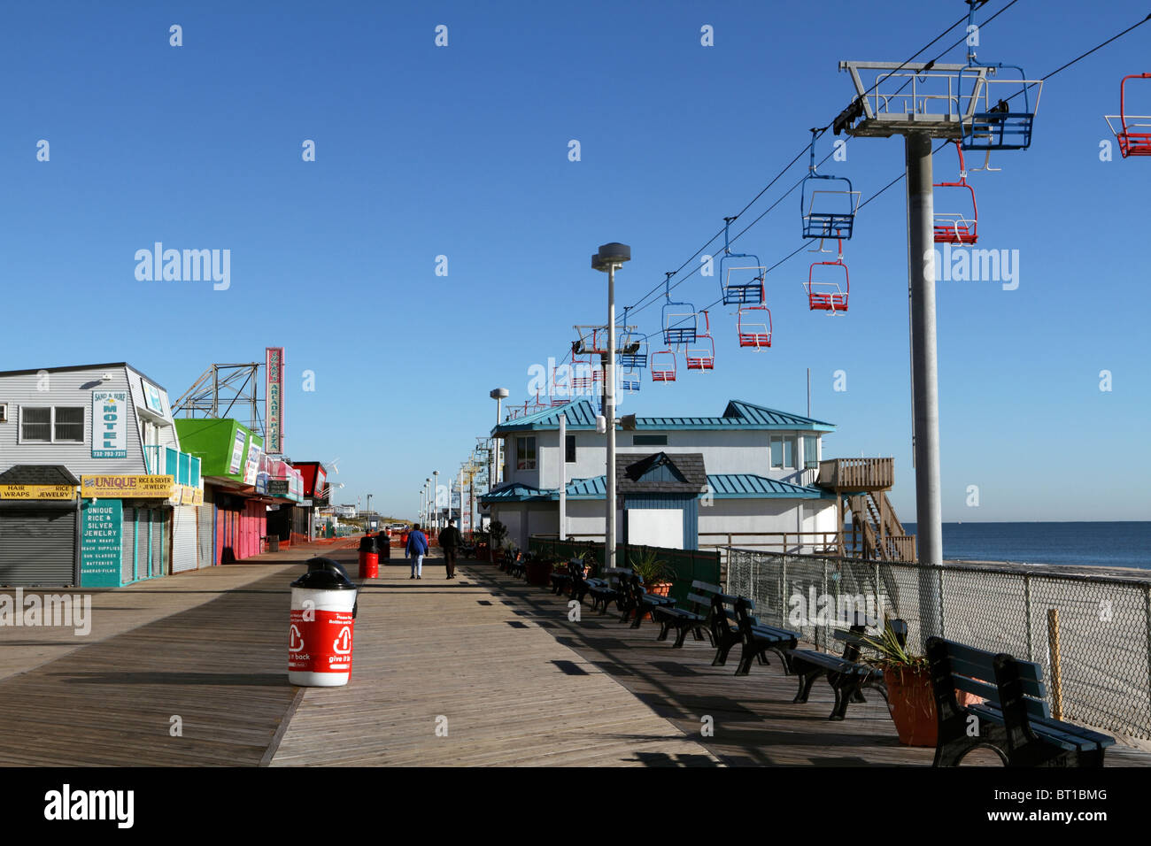 Seaside Heights New Jersey USA boardwalk with chair lift ride on the beach running along side. Seaside Heights, New Jersey, USA. Stock Photo