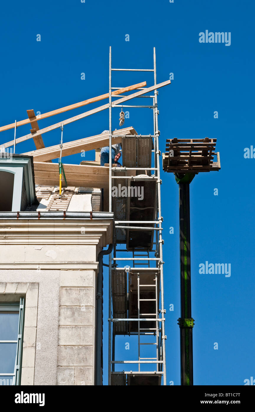 Contractors working on roof repairs with Altrad prefabricated