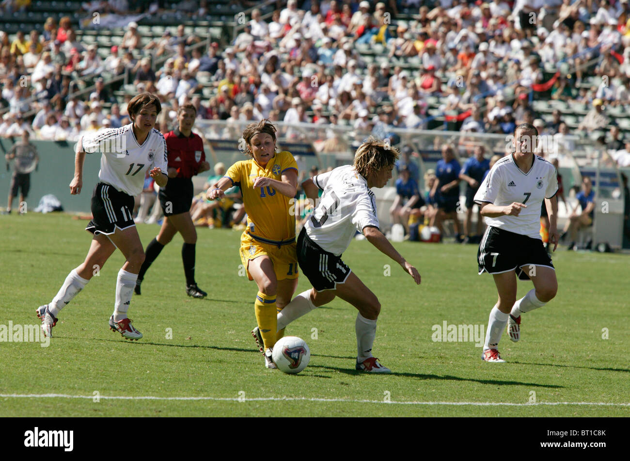 Hanna Ljungberg of Sweden (10) drives past Sandra Minnert of Germany (13) during the 2003 Women's World Cup soccer final. Stock Photo
