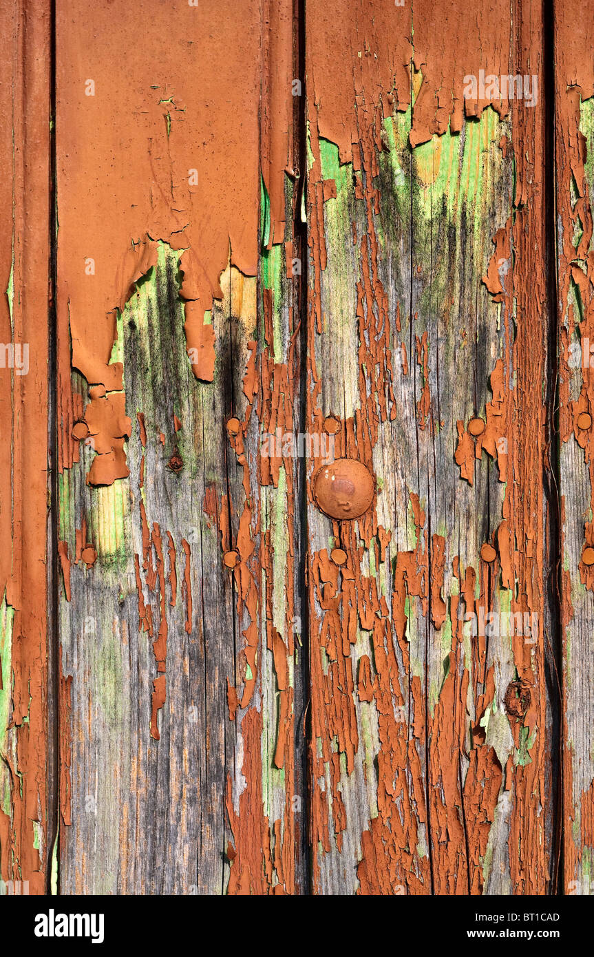 Old garage door showing badly flaking paint France Stock Photo Alamy