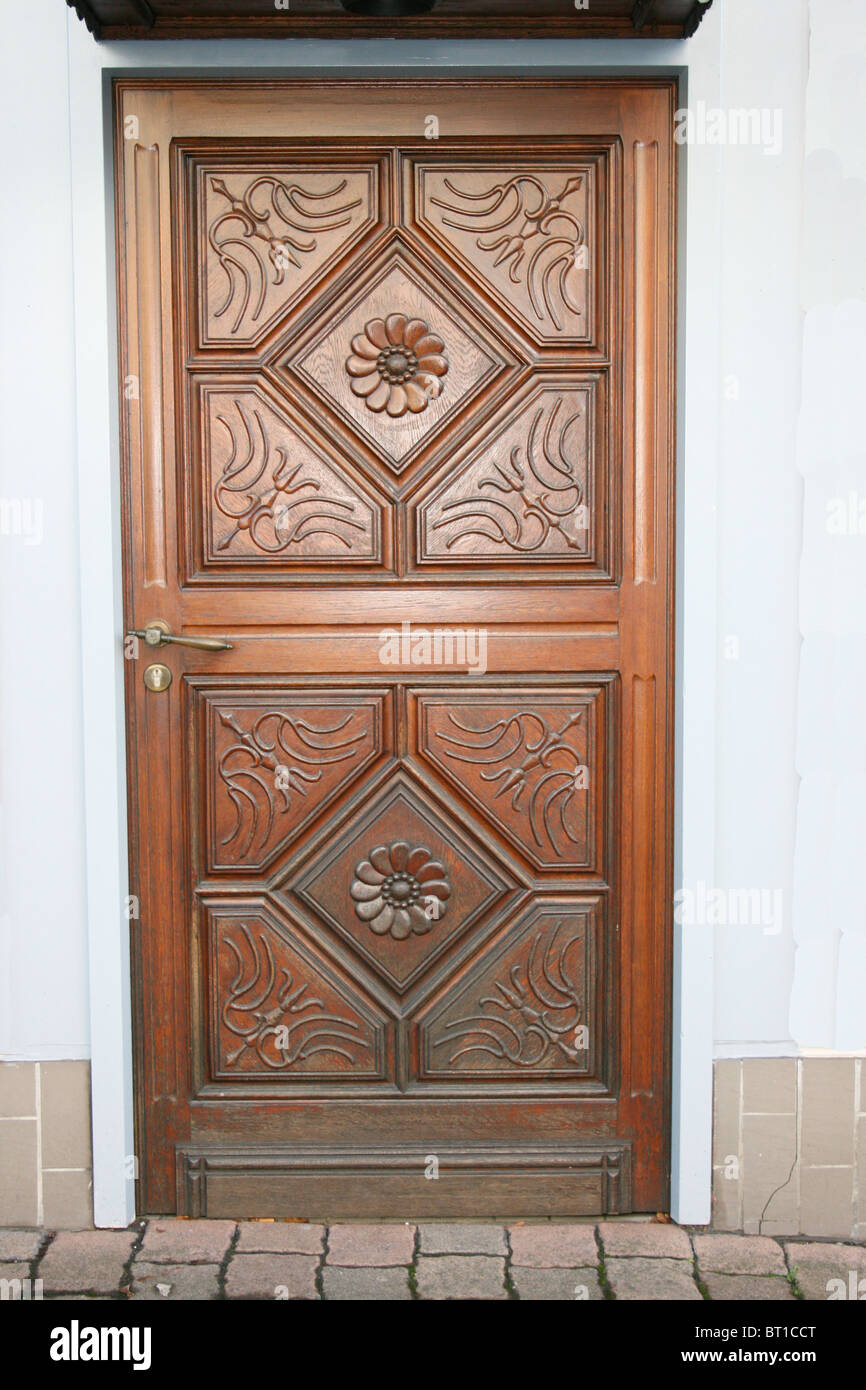 ornate wood front door Stock Photo - Alamy