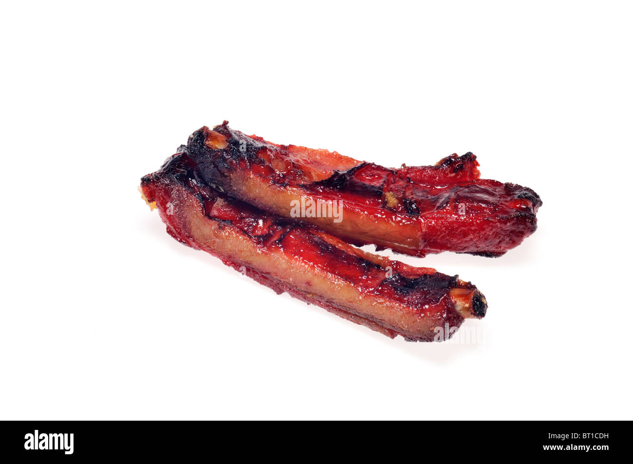 2 cooked pork spareribs on white background cutout. Stock Photo