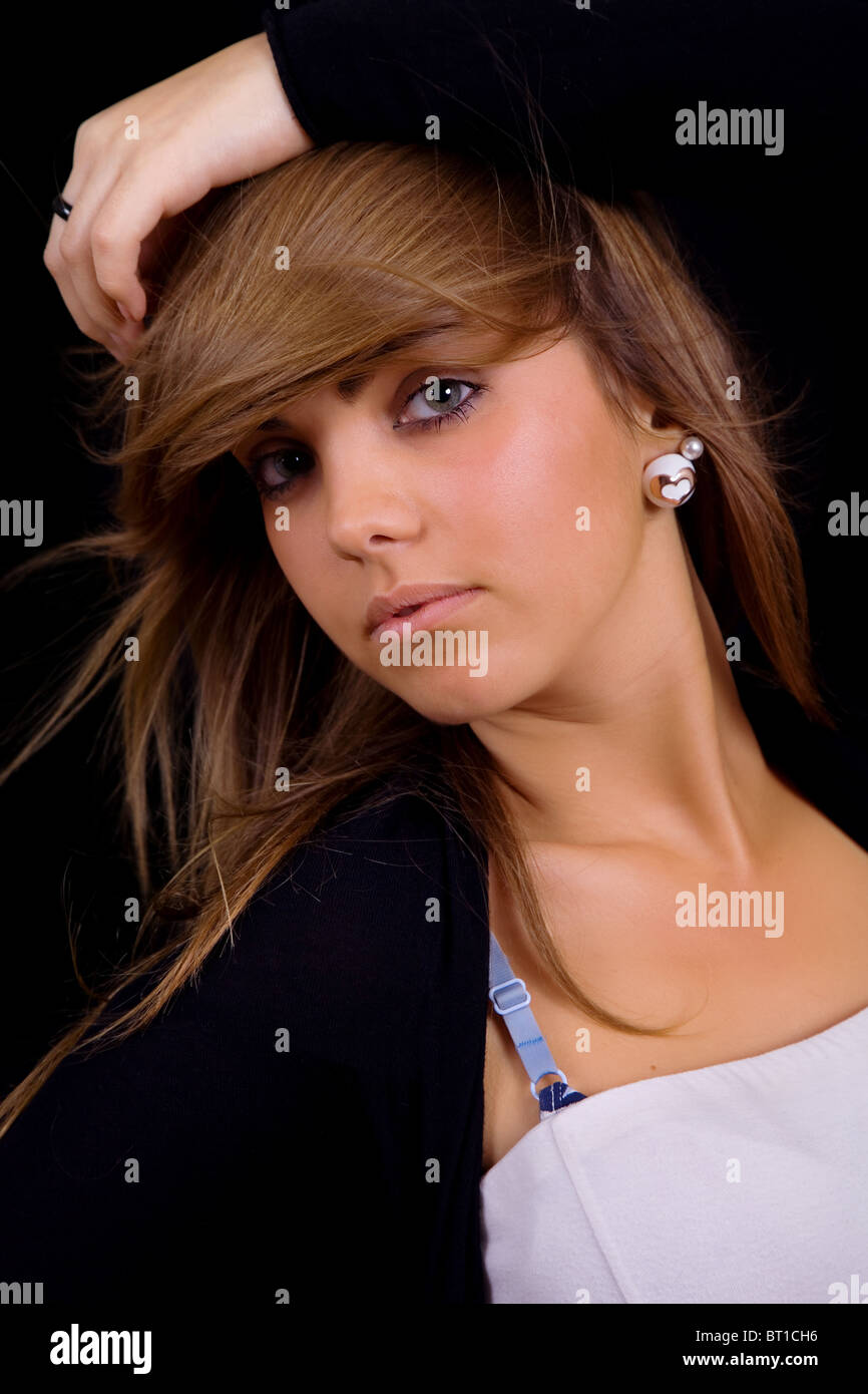 young beautiful girl portrait against black background Stock Photo - Alamy