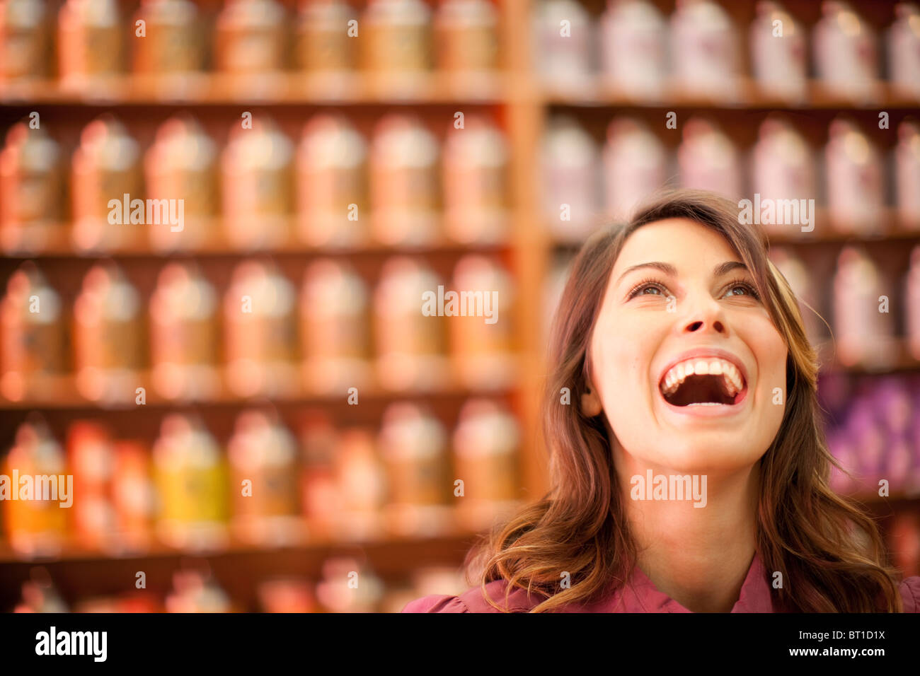Caucasian woman looking up and laughing Stock Photo