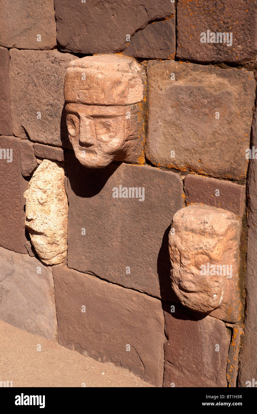 Carved heads and faces in the Templete Semisubterraneo, at Tiwanaku archeological site, a pre Inca civilization, in Bolivia. Stock Photo