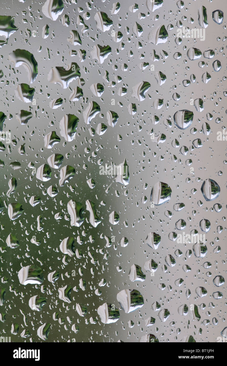 Raindrops on window pane photographed from inside. October 2010 Stock Photo