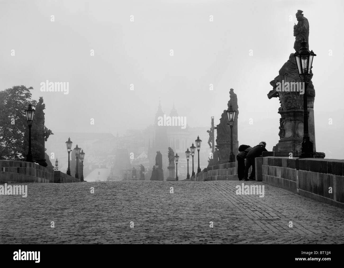 Prague - Charles bridge in the morning fog Stock Photo