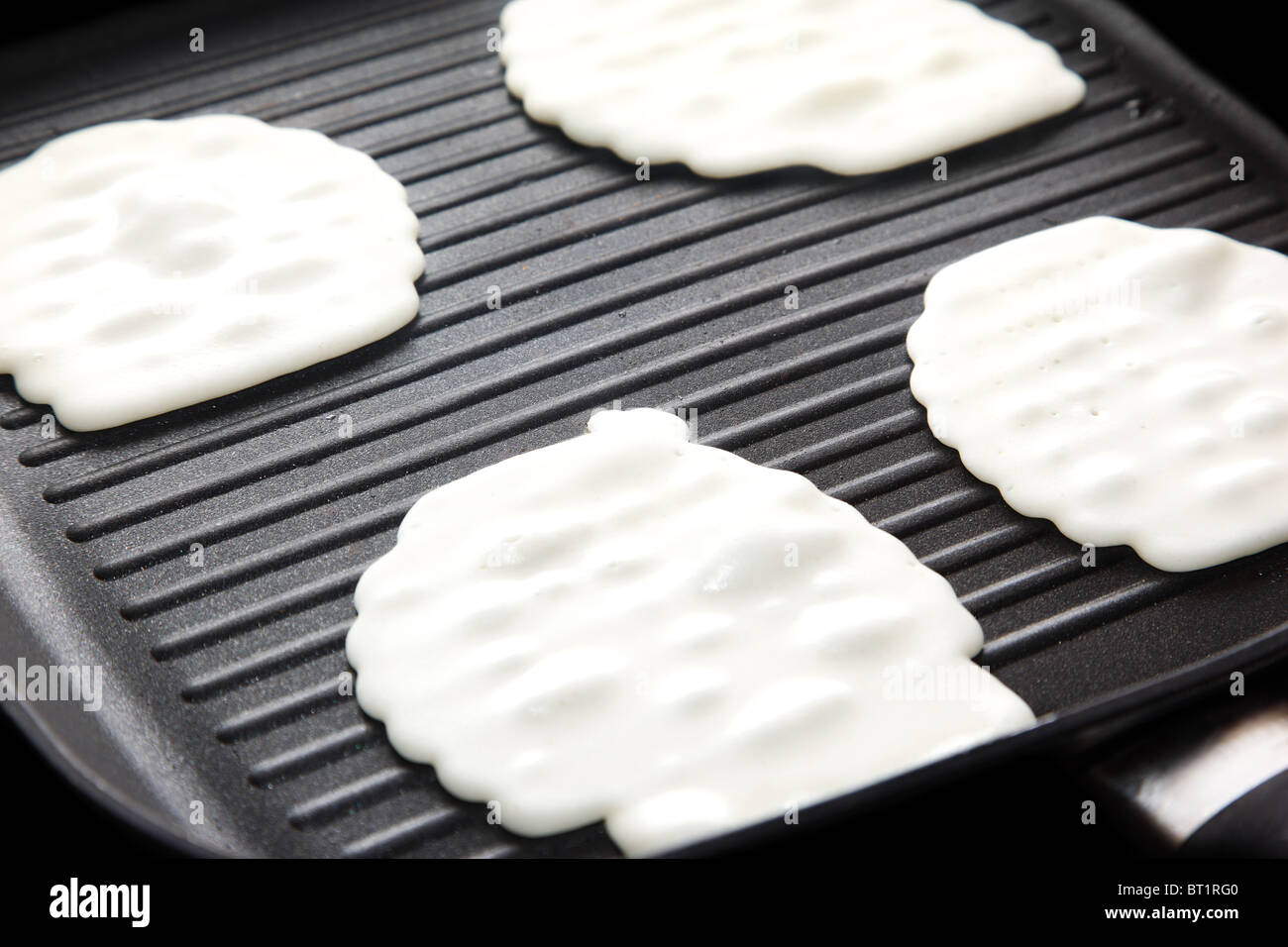 Cooking pancakes on the hot frying pan Stock Photo Alamy