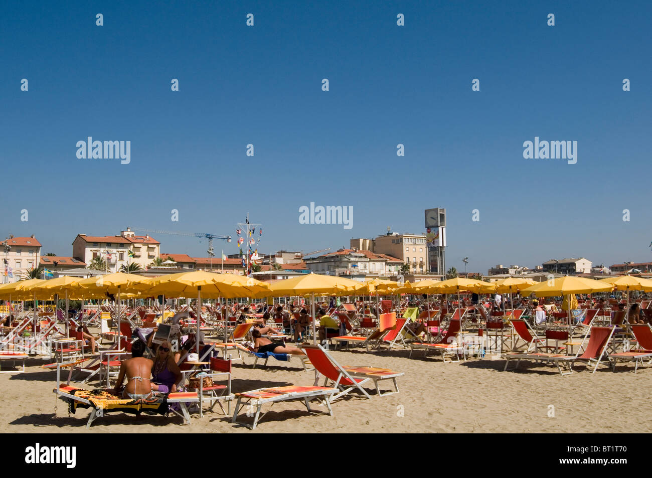 viareggio beach private italian seaside town holiday destination sun shade sunshade umbrella sun sunny hot sand sandy italy well Stock Photo