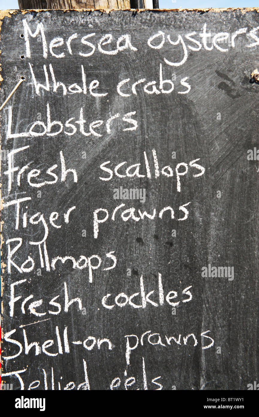 Blackboard displaying fresh Mersea Oysters and locally caught seafood Stock Photo