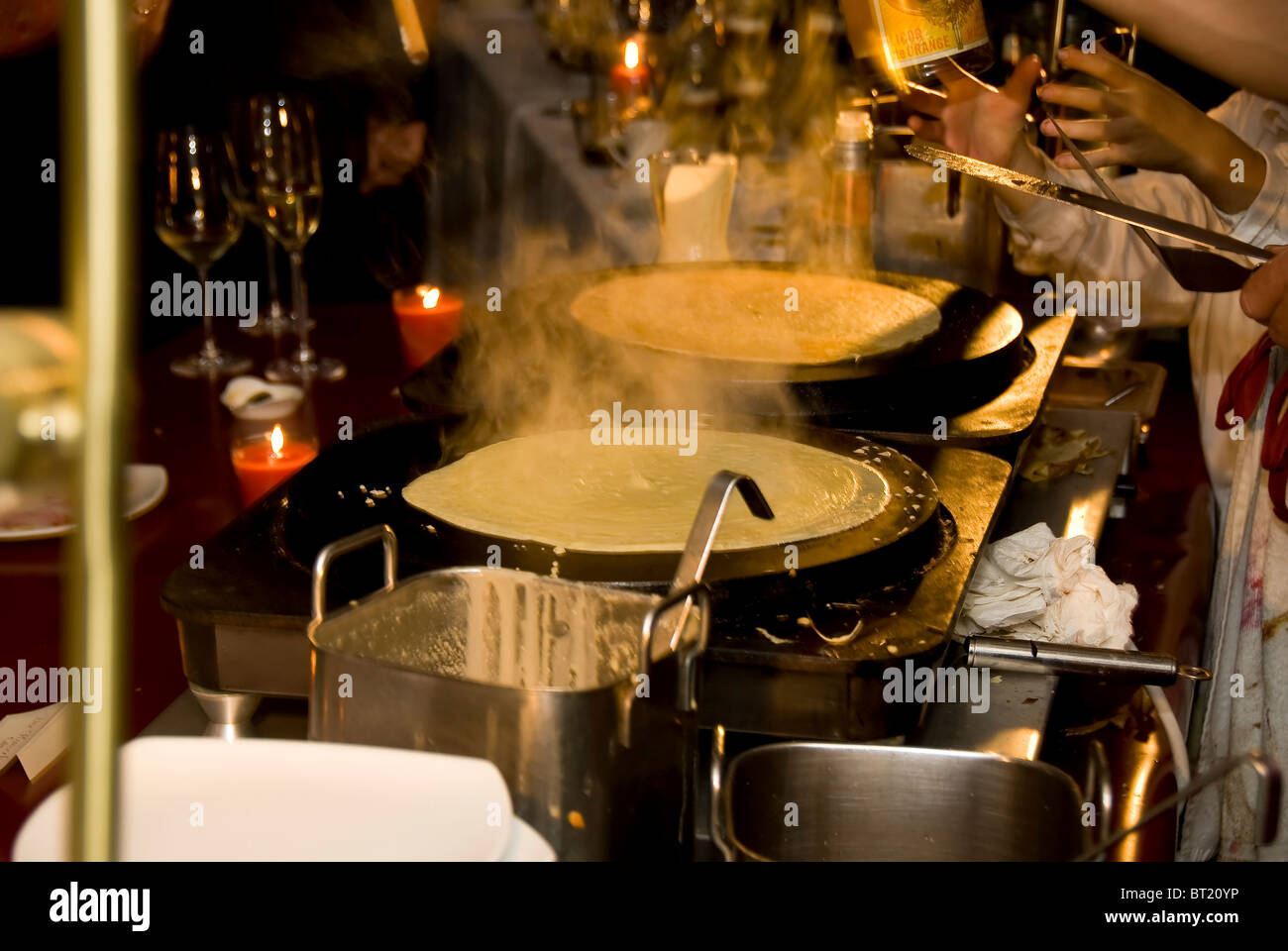 Busy crepe kitchen with two crepes ready Stock Photo Alamy
