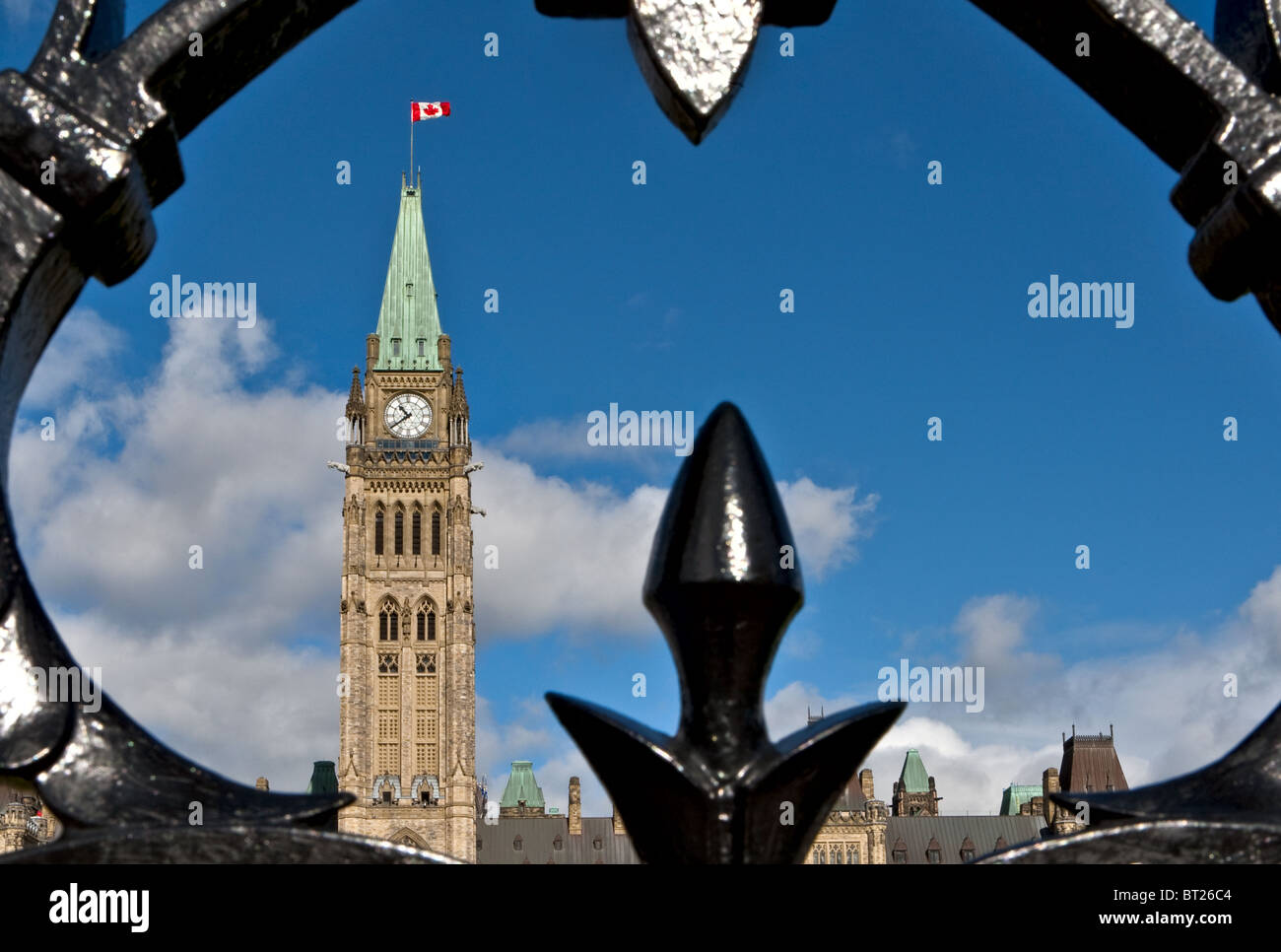 The Parliament Peace Tower is seen through the front fence in Ottawa Stock Photo