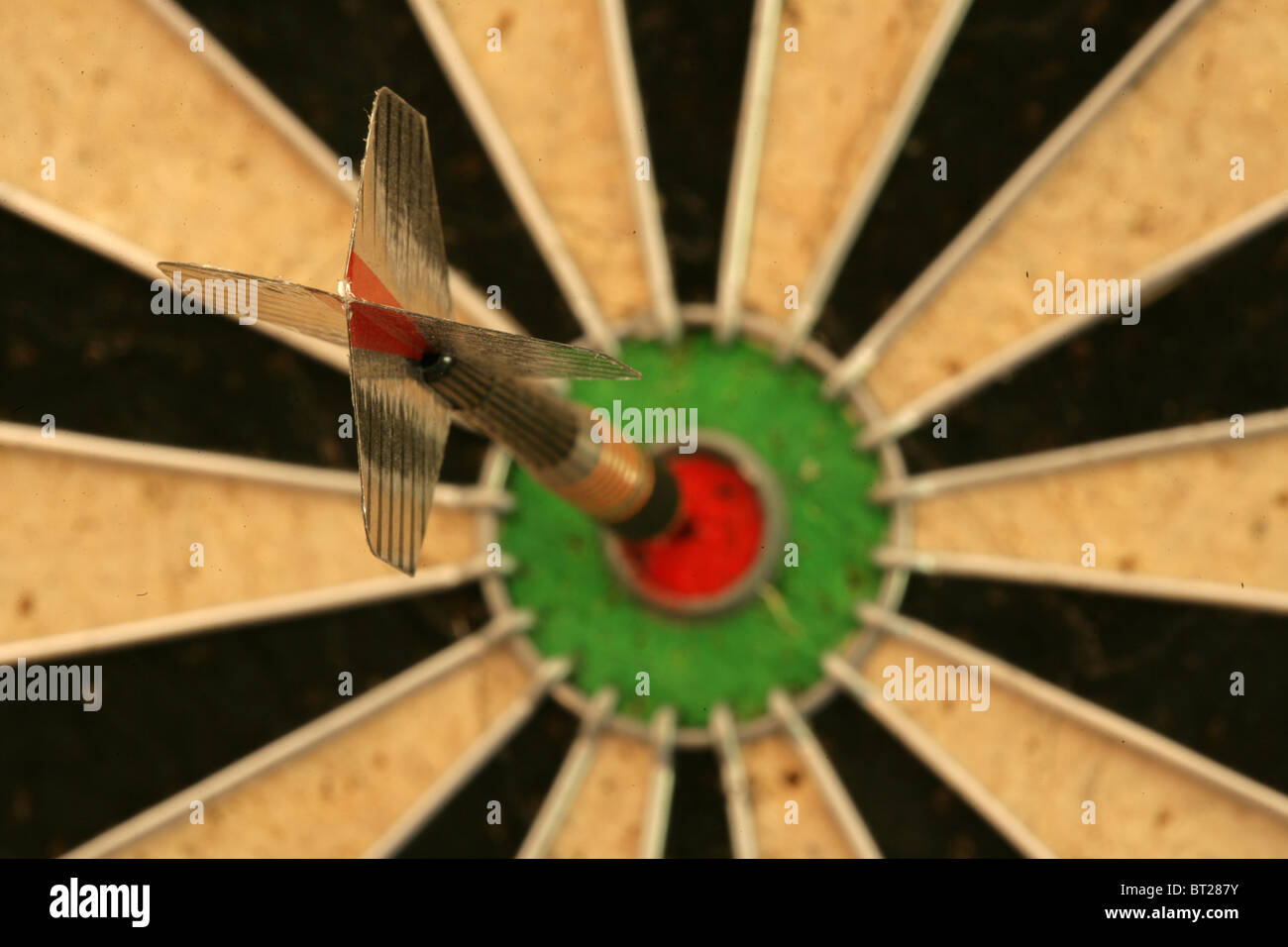 Dart in bullseye on dartboard Stock Photo