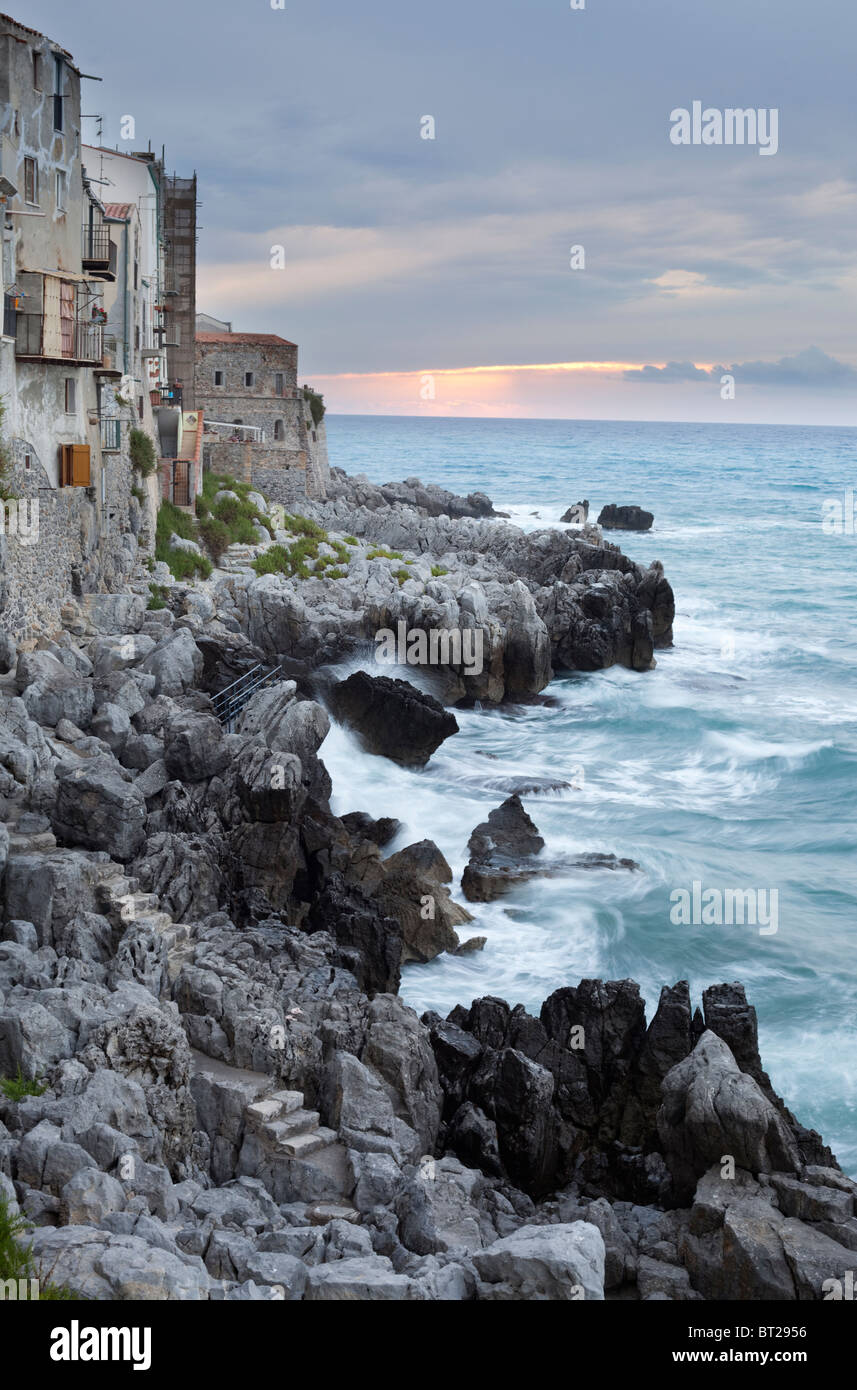 The dramatic coastline with water bashing on the rocks. Stock Photo