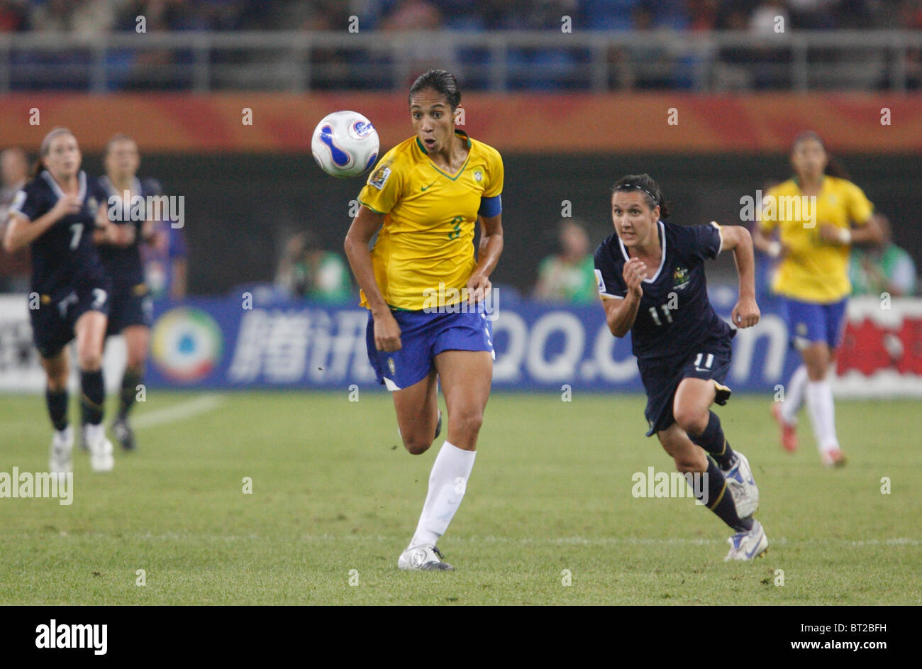 Brazil team captain Aline (3) chases the ball during a 2007 Women's World Cup quarterfinal soccer match against Australia. Stock Photo