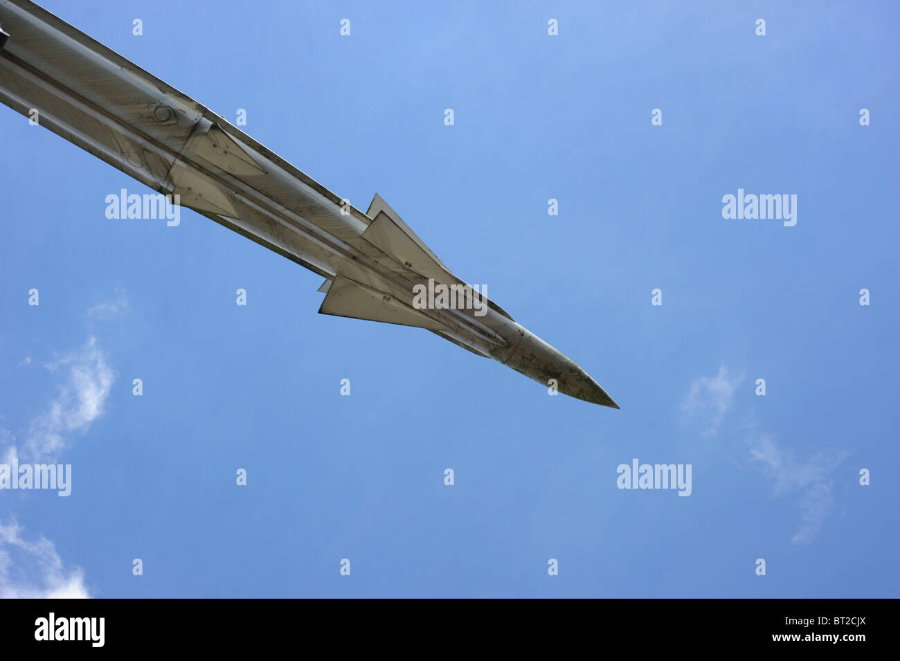 Air to air missile against a clear blue sky Stock Photo - Alamy