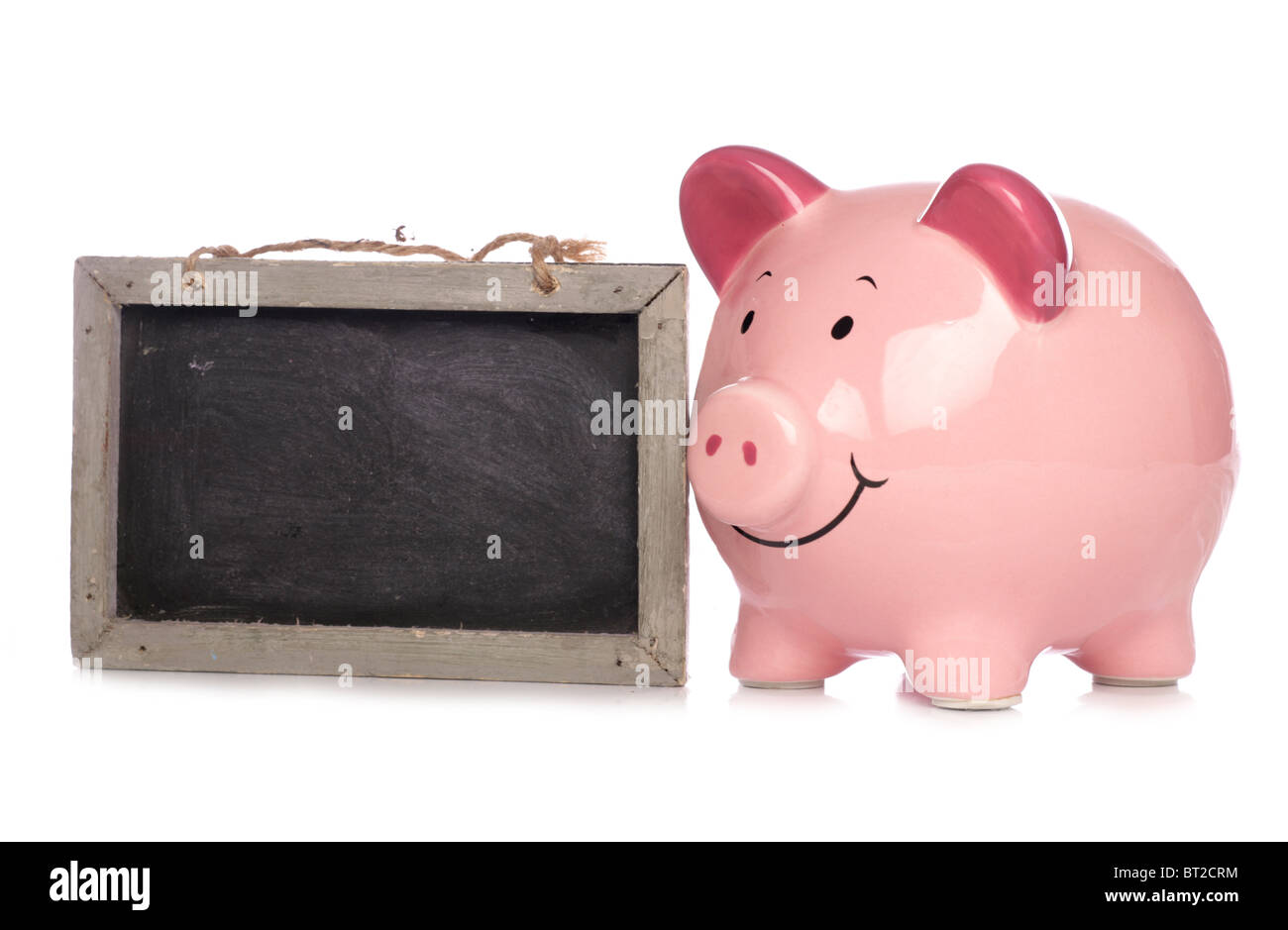 Piggy bank with chalkboard studio cutout Stock Photo