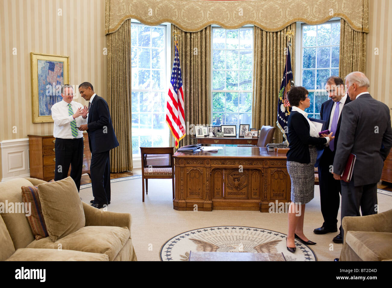 President Obama talks with Press Secretary Robert Gibbs in the oval office Stock Photo