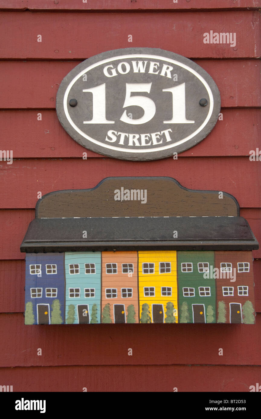 Canada, Newfoundland and Labrador, St. John's. Historic colorful St. John's home with typical folk art 'house' mailbox. Stock Photo