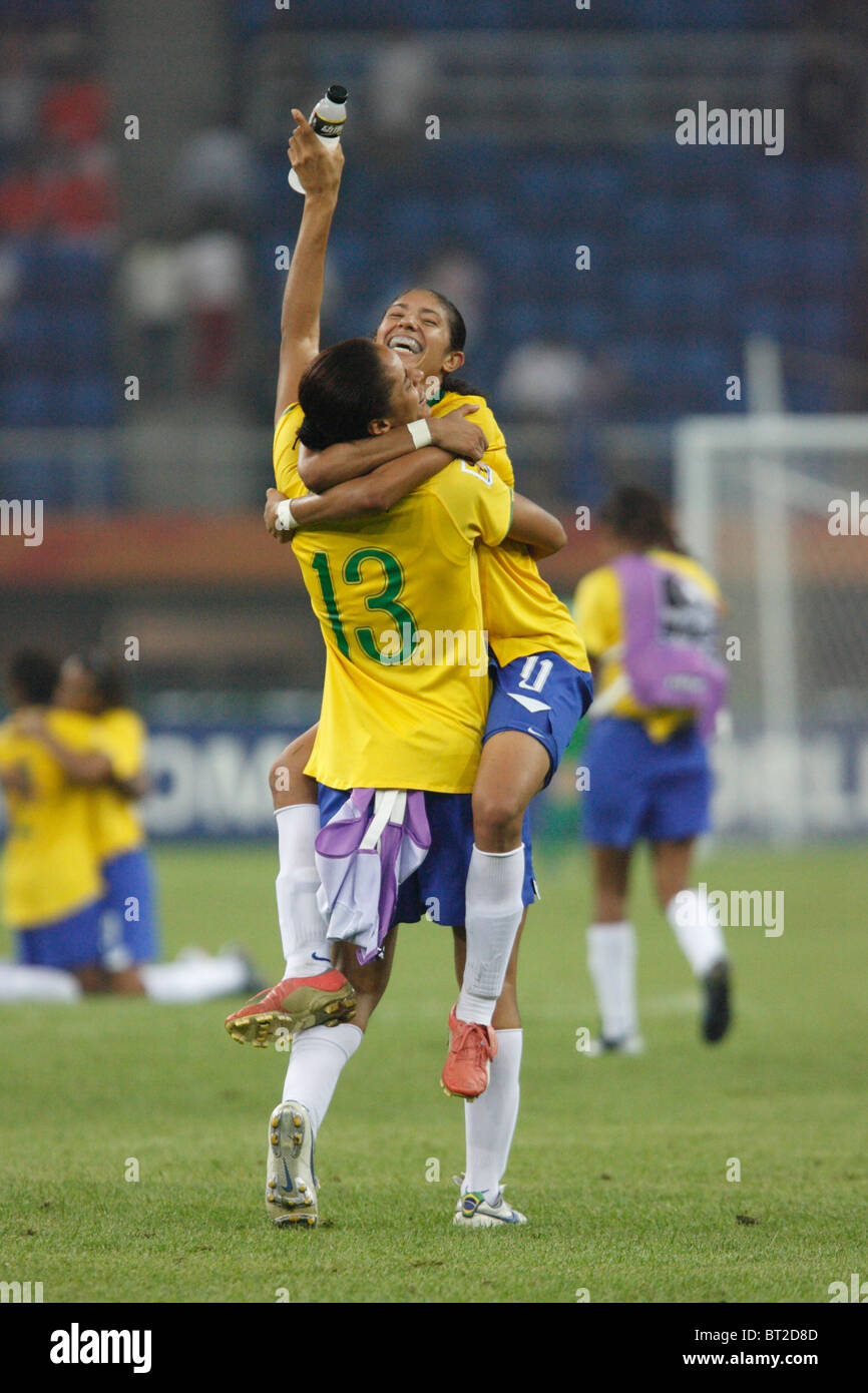 Monica (13) and Cristiane (11) of Brazil celebrate after defeating Australia in a 2007 Women's World Cup quarterfinal match. Stock Photo