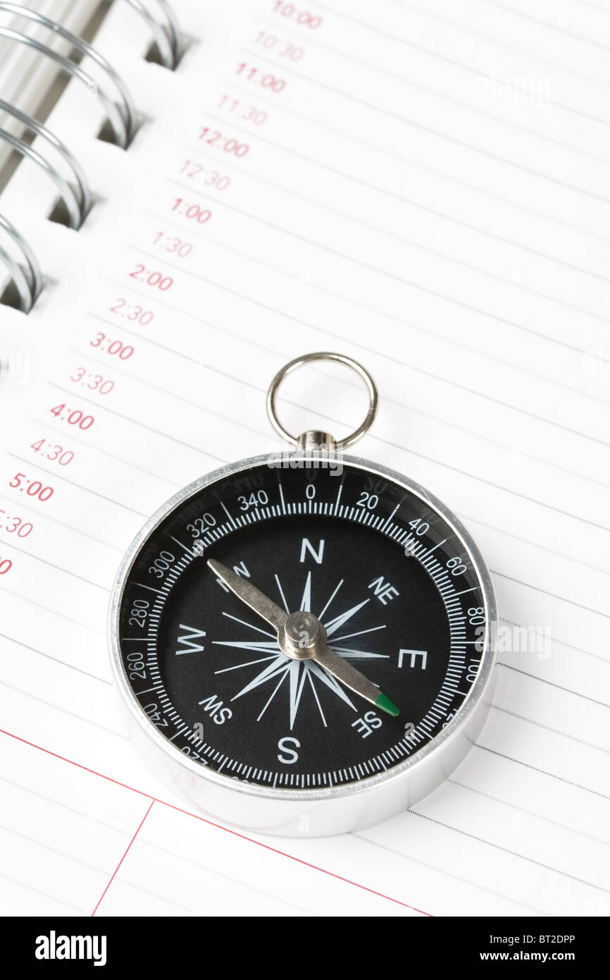 Calendar agenda and compass, concept of time Planning Stock Photo