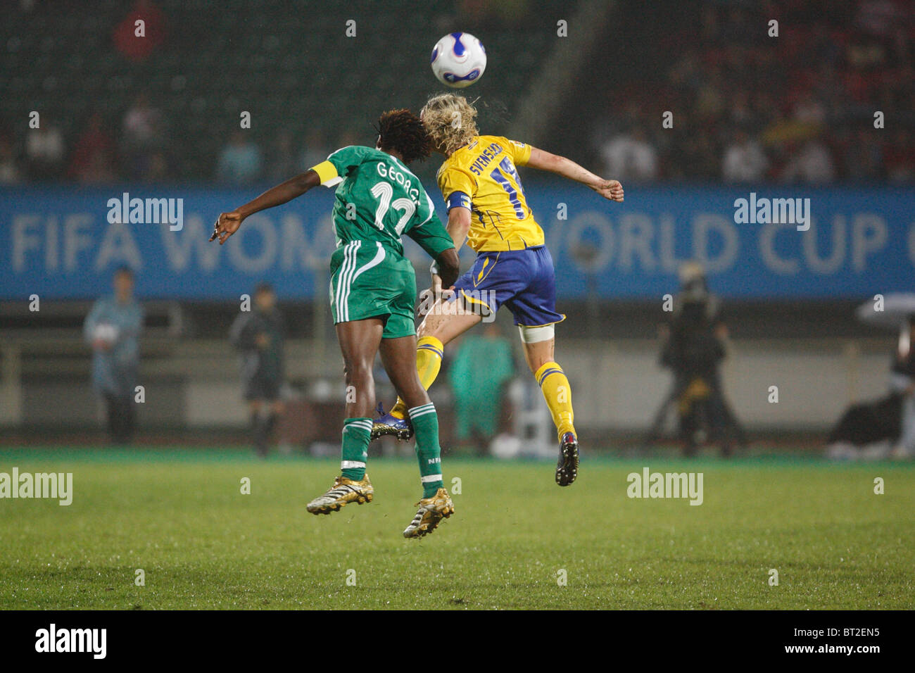 Christie George of Nigeria (l) and Victoria Svensson of Sweden (r) vie for a header during a 2007 Women's World Cup soccer match Stock Photo
