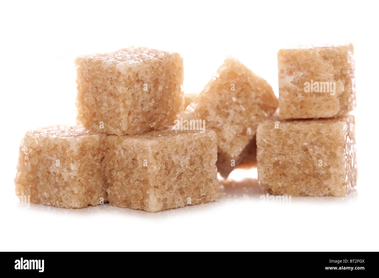 Pile of brown demerara sugar cubes studio cutout Stock Photo