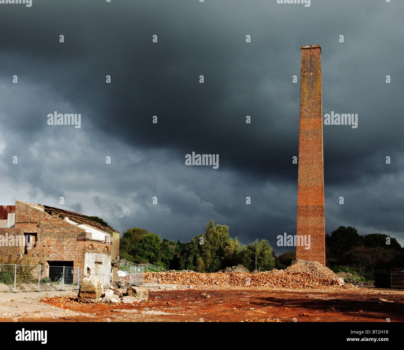 Old industrial chimney stack, prepped for demolition. Stock Photo