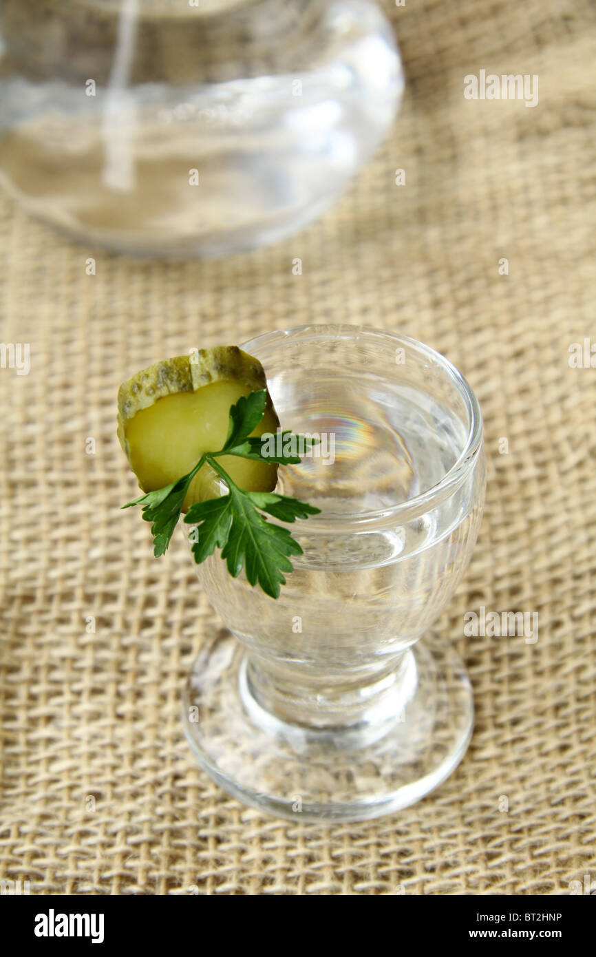 Russian vodka with pickles parsley and bottle Stock Photo
