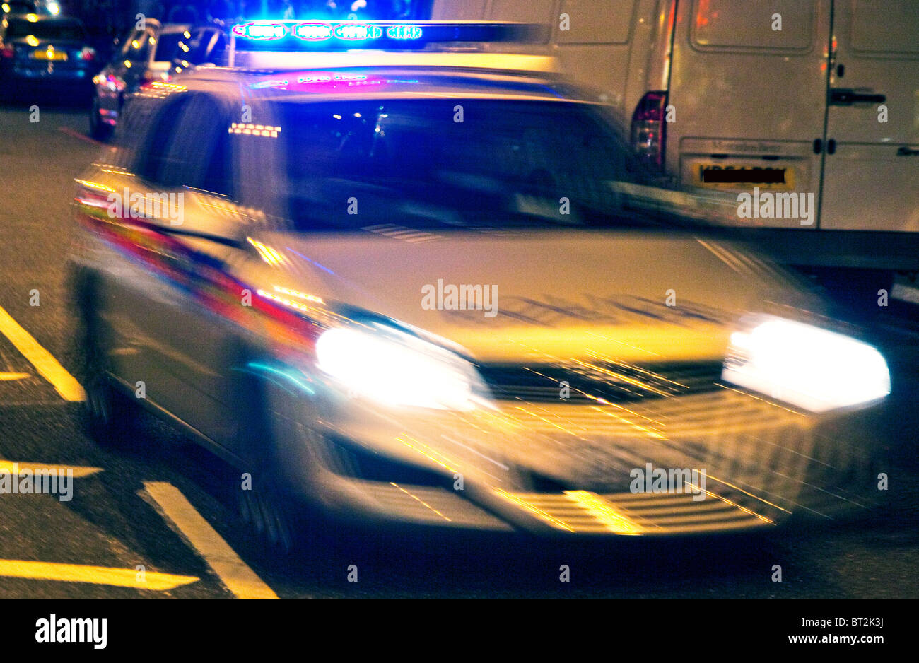 Speeding police car at night, London Stock Photo