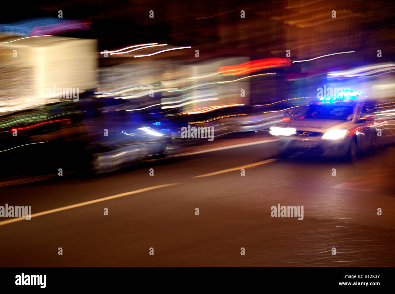 Speeding police car at night, London Stock Photo