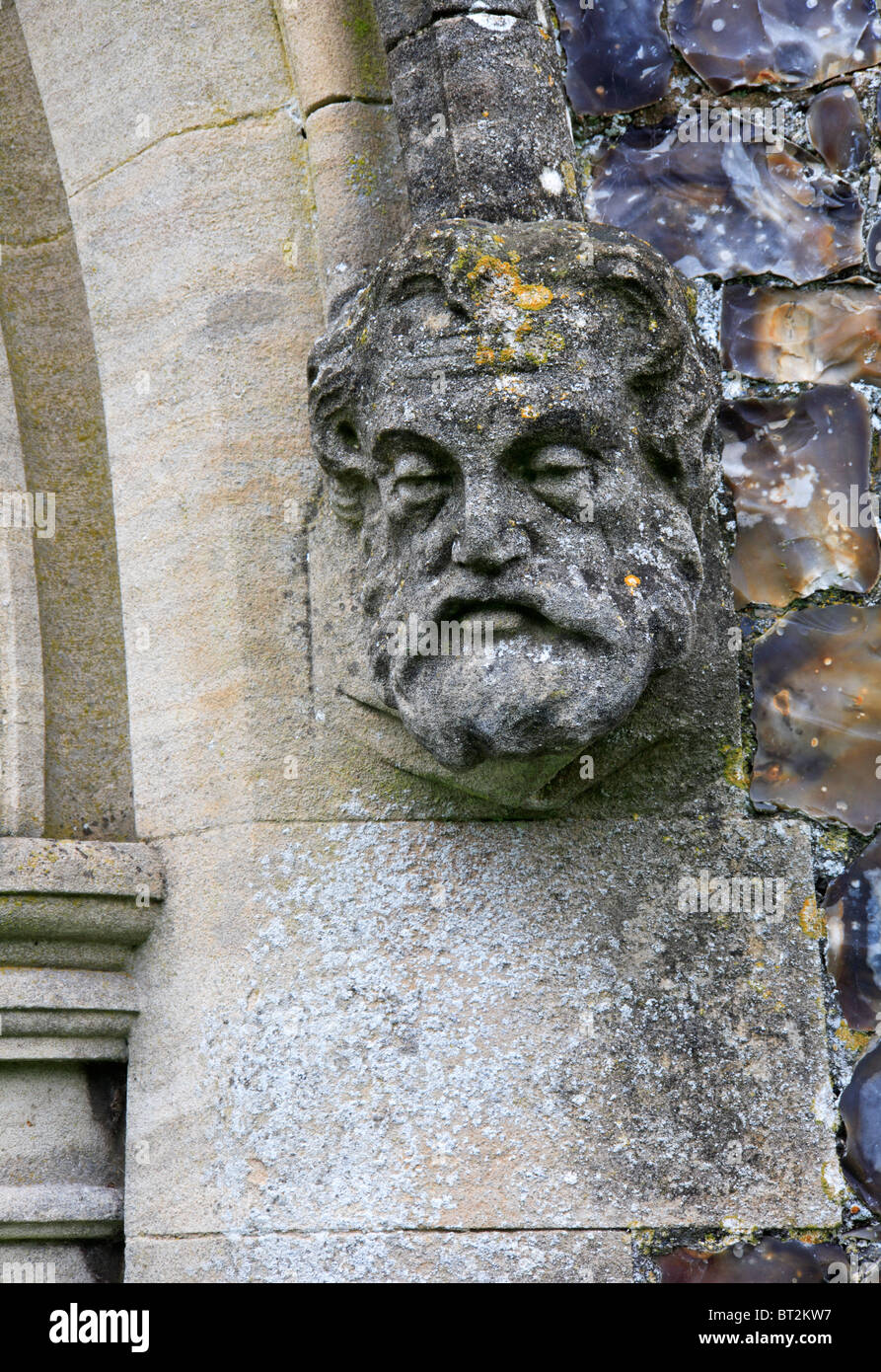 A stone effigy on the archway of the south porch of the Church of St Peter at Haveringland, Norfolk, England, United Kingdom. Stock Photo